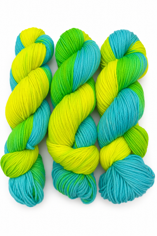 Lime Wire hand-dyed DK weight yarn in hot pink, red, and electric green