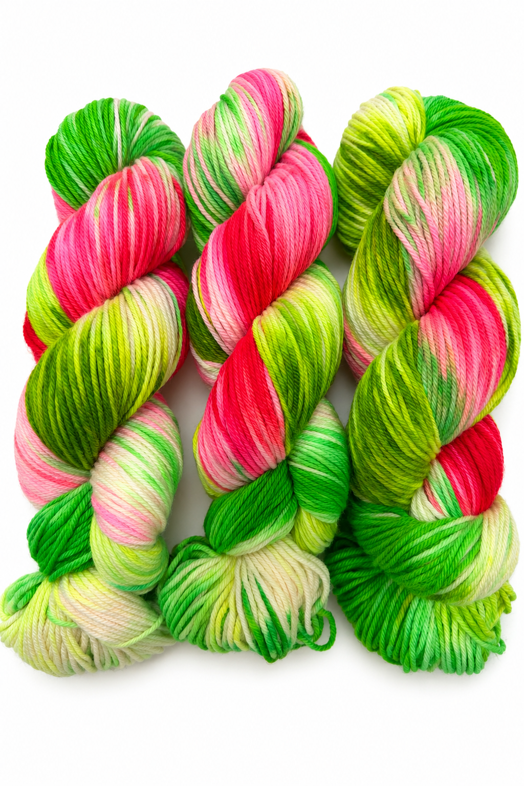 Pasteque hand-dyed DK weight yarn in hot pink, neon orange, and electric yellow